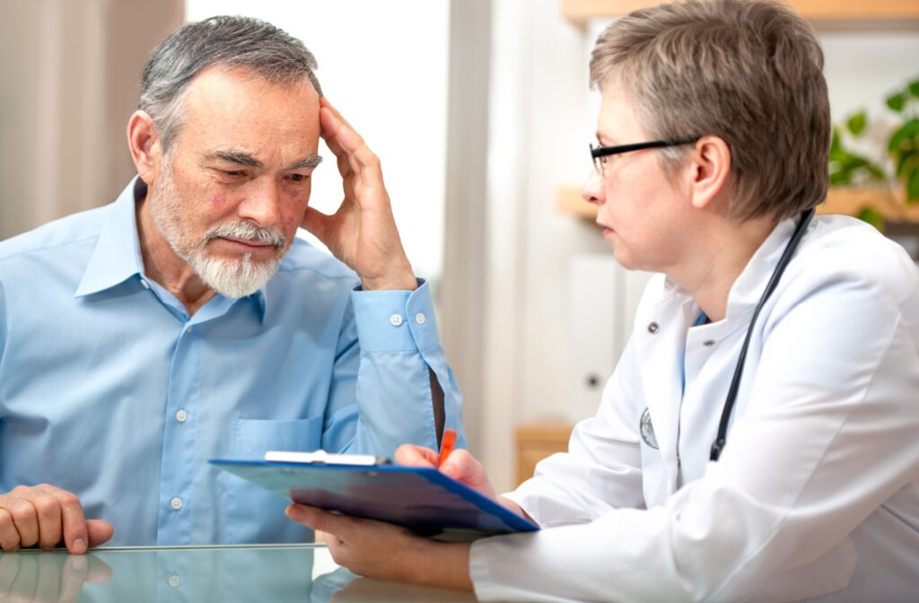 An older adult discusses their cognitive health concerns with their doctor.