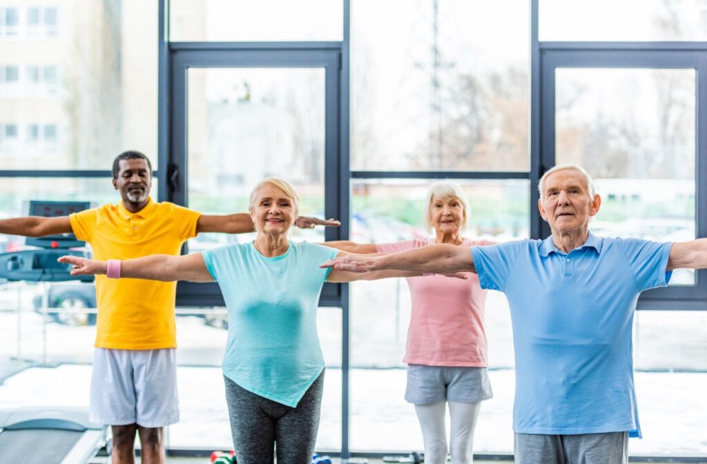 A group of older adults participate in an exercise class.