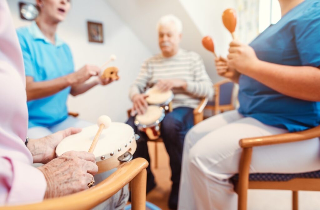 A group of seniors participate in a music therapy class